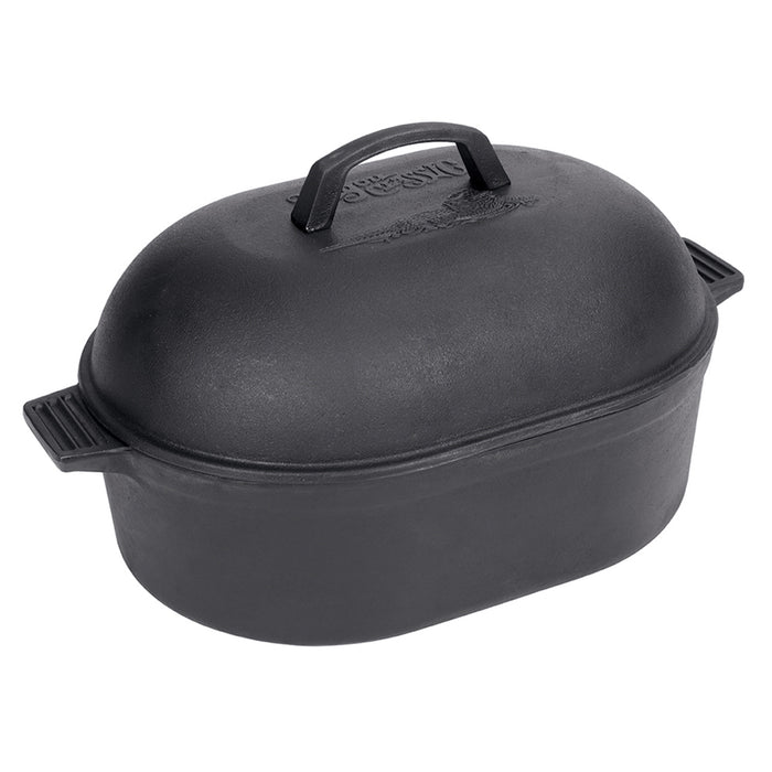 A black cast iron oval roaster with a domed lid and side handles on a white background