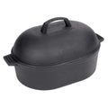 A black cast iron oval roaster with a domed lid and side handles on a white background