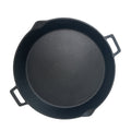 Overview of cast iron skillet with two helper handles on a white background