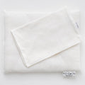 A white merino wool toddler pillow with a soft cotton knit pillowcase, displayed on a white background.