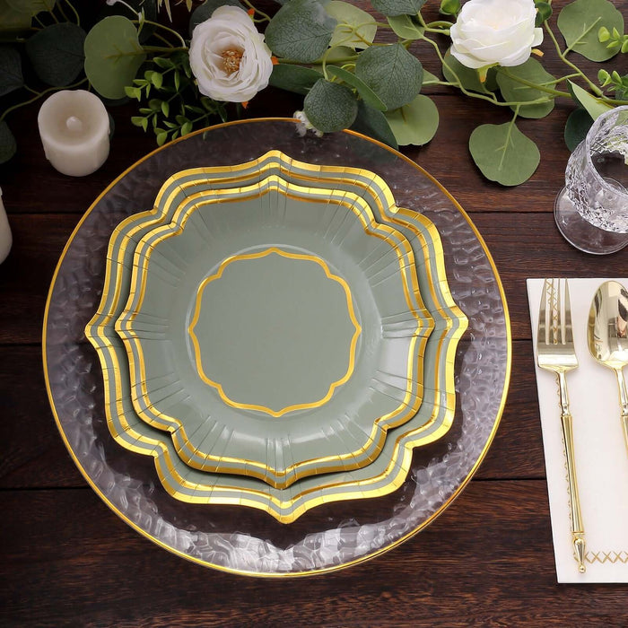 Elegant green and gold decorative plates on a wooden table.