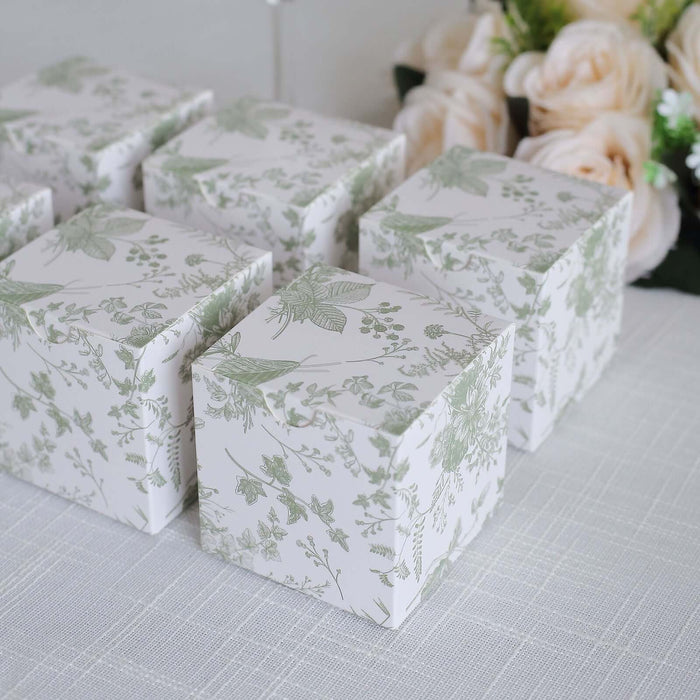 Decorative gift boxes with floral design on a light background.