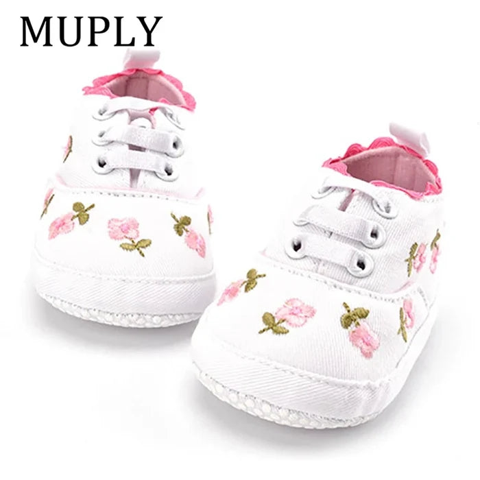 Baby girl floral embroidered soft sole crib shoes by Home Sweet Home, featuring delicate floral embroidery and comfortable first walker design.