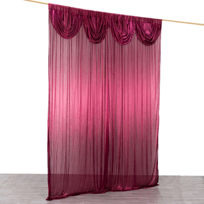 Sheer burgundy curtain with draped design on a wooden rod.