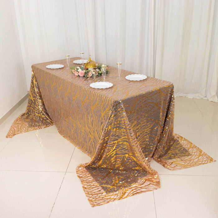 Elegant gold patterned tablecloth draped over a table for special occasions.