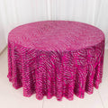 Round pink tablecloth with white swirl pattern on a plain background.
