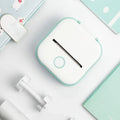 Beckett portable printer with compact design, showing a sleek black device and paper output on a plain background.