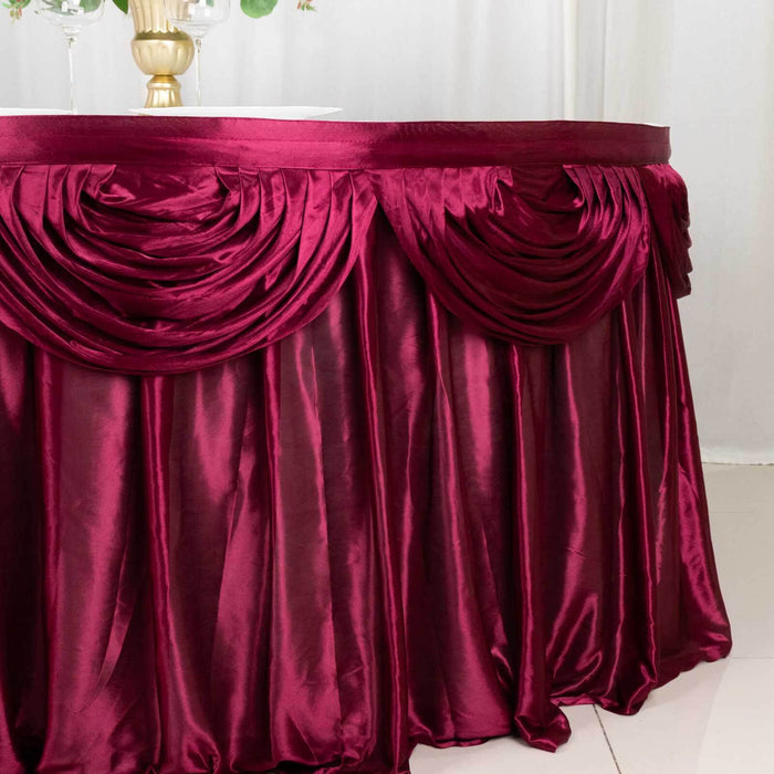 Burgundy tablecloth with elegant draping and pleats