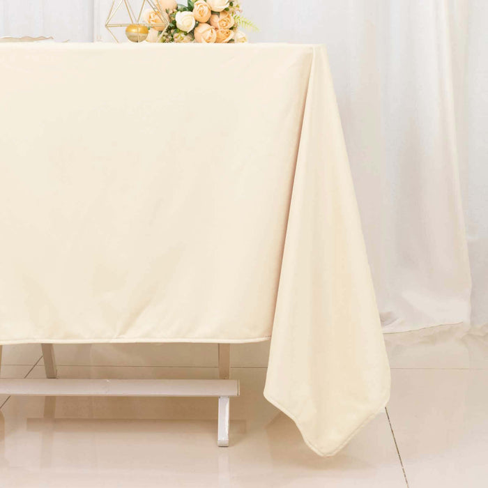 Elegant beige tablecloth draped on a table, perfect for events and decor.