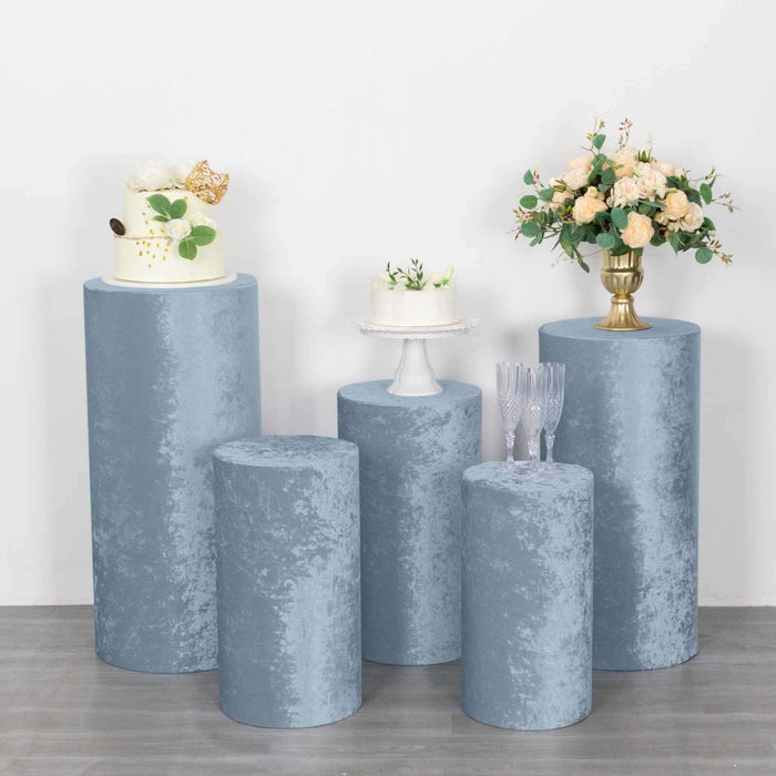 Elegant blue velvet display pedestals for events and decor.