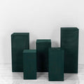 Green display pedestals in various heights on a white backdrop