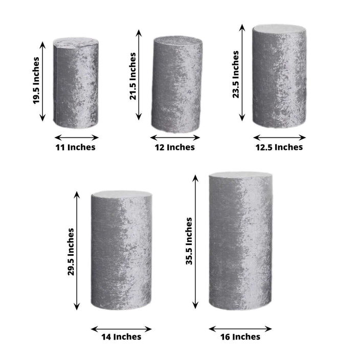 Set of five cylindrical pedestals in varying heights and sizes for display.
