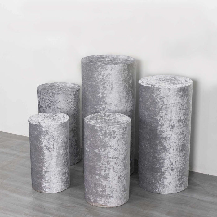 Gray velvet pedestals in various heights, perfect for display and staging.