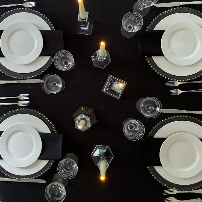 Retro style setting for chic Newport event including Silver Beaded chargers and white dinnerware.