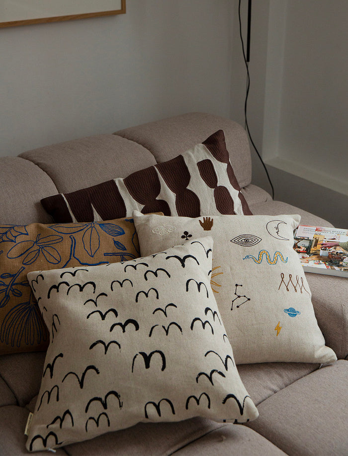 SYMBOL EMBROIDERED CUSHION COVER