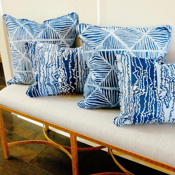 four pillows on a bench